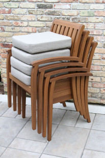 20505 - Deluxe Stacking Arm Chair with Olefin Cushion, 4pk. Stacked with Cushions